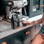 Paddy & Scott's Chit Chat Ground Coffee Next To Espresso Machine