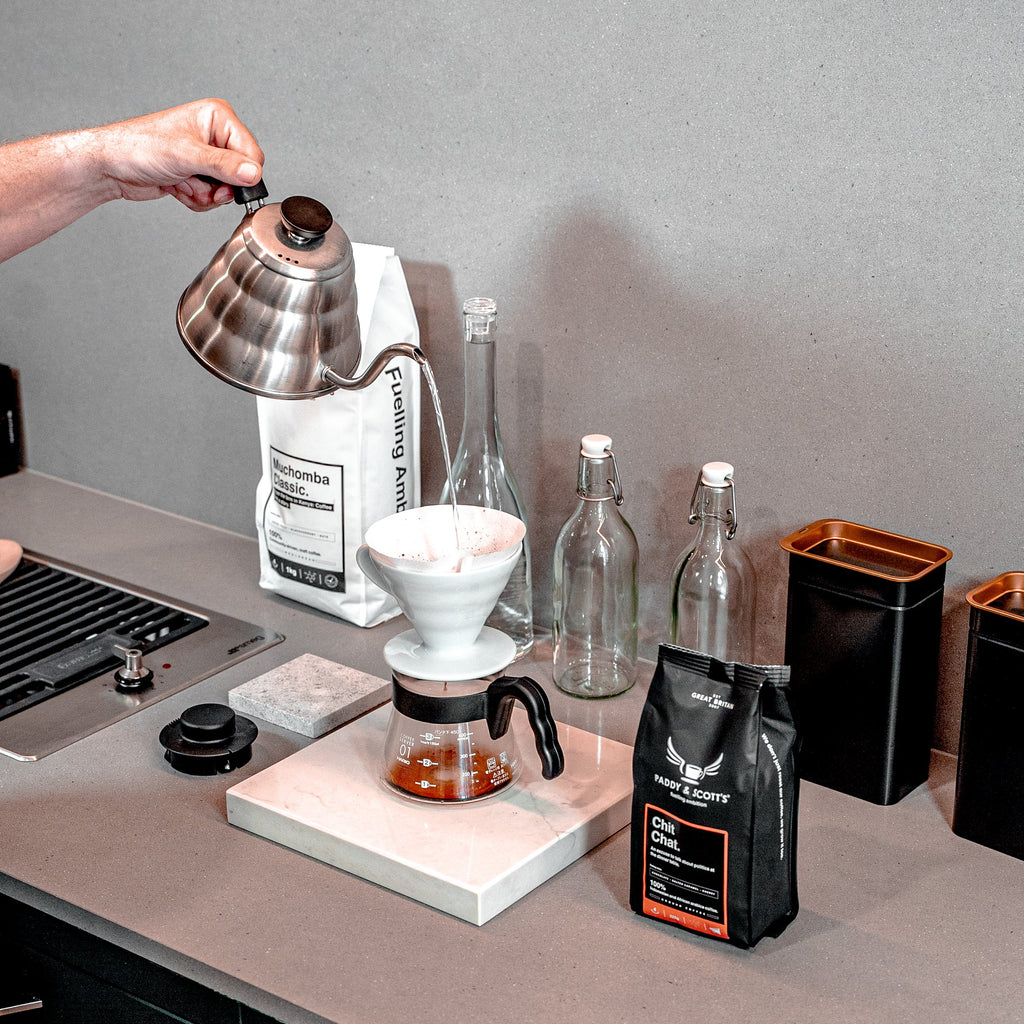 Paddy & Scott's Chit Chat Ground Coffee Being Poured Through A Coffee Filter